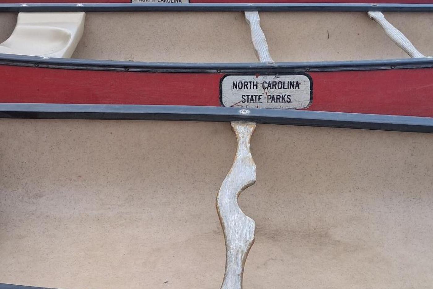 Canoes sit ready for a paddle at Hanging Rock's lake. 