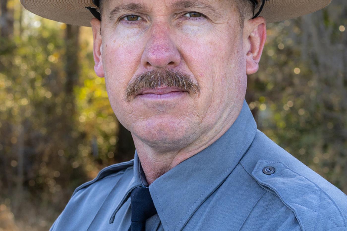 a headshot of a park ranger 
