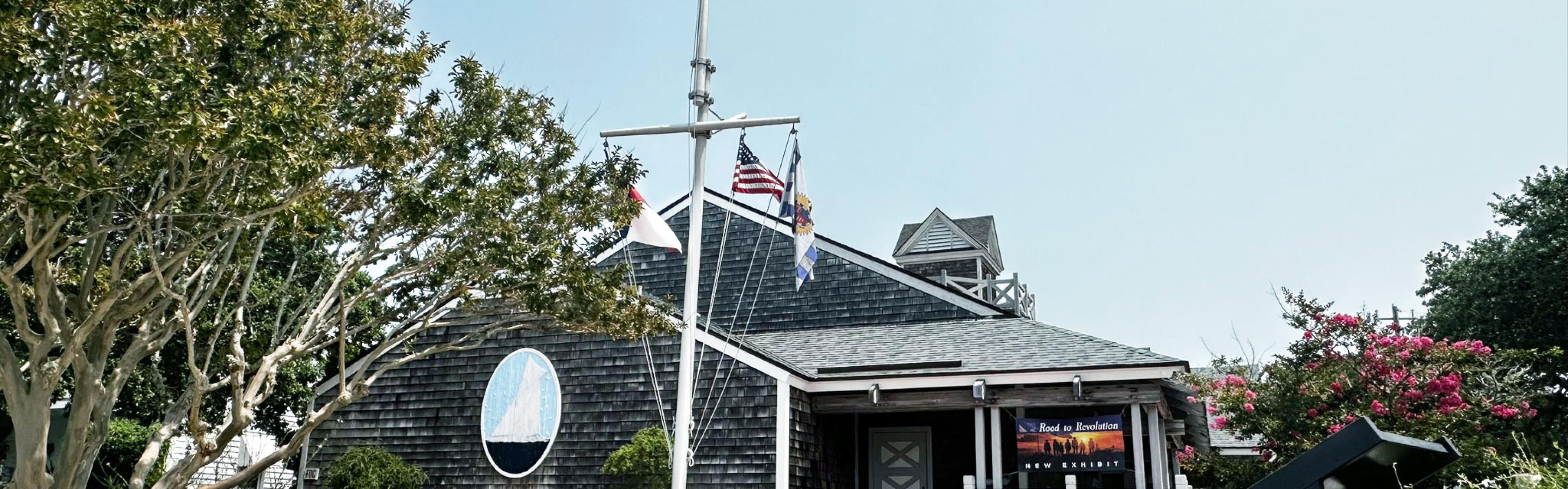 NC Maritime Museum Exterior View of museum building with flagpole and stairs in front