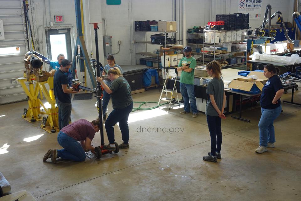 Caroline assists with unloading cannon