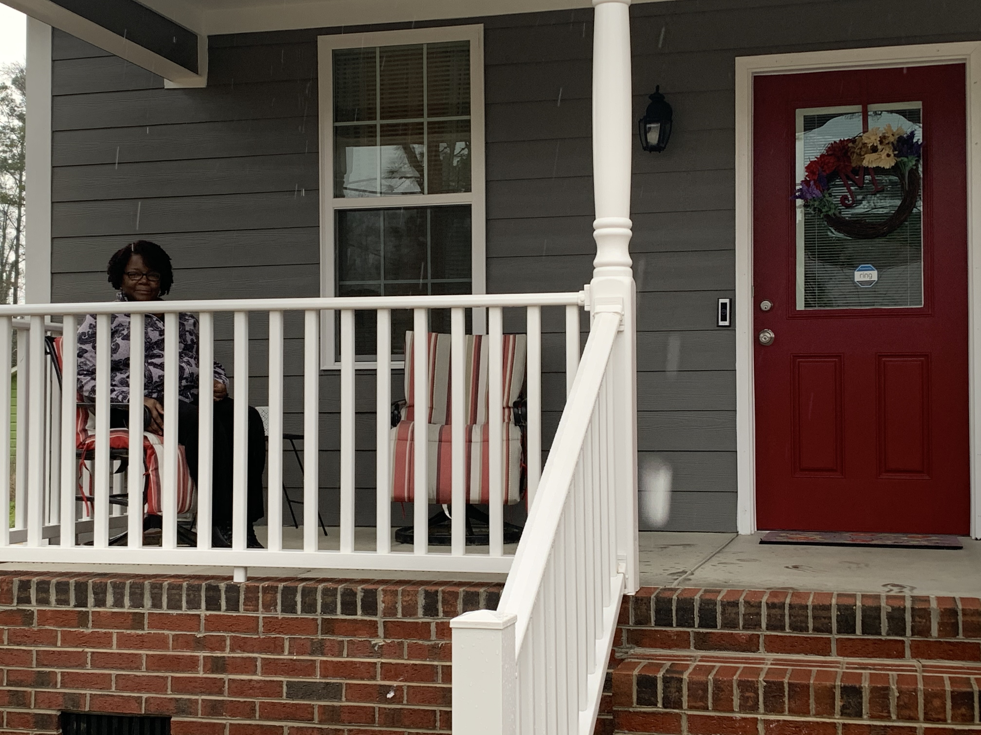 Doreen McNeil sitting on her front porch