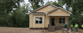 New home being constructed with crew