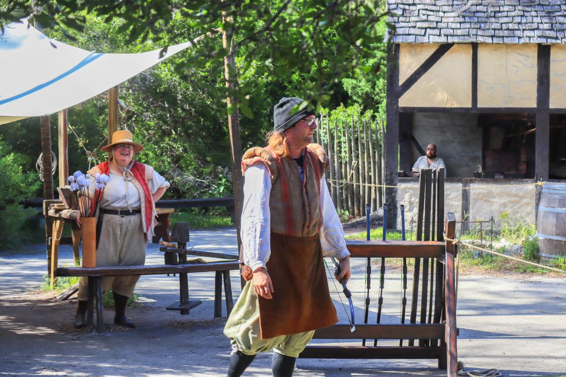 Two costumed interpreters in the Settlement Site 