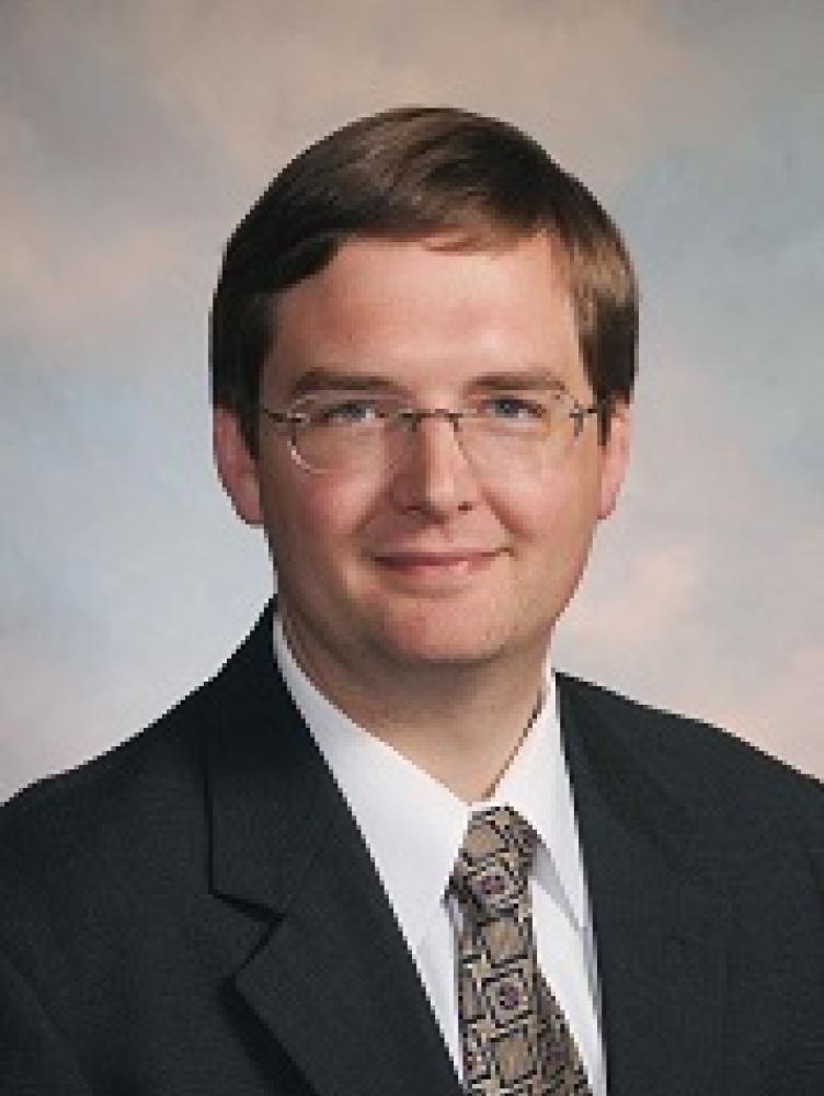 Headshot of Stacy Eggers IV.