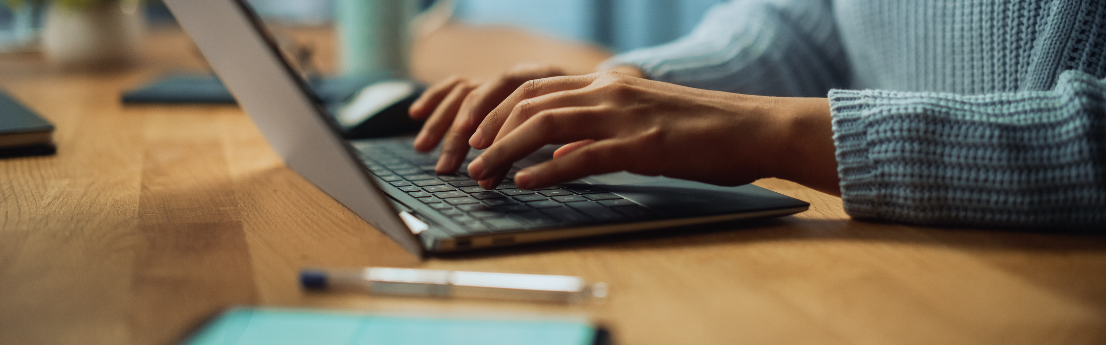 Hands of a person completing their voter registration from their laptop.