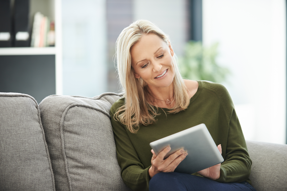Image of a woman on a tablet browsing the internet