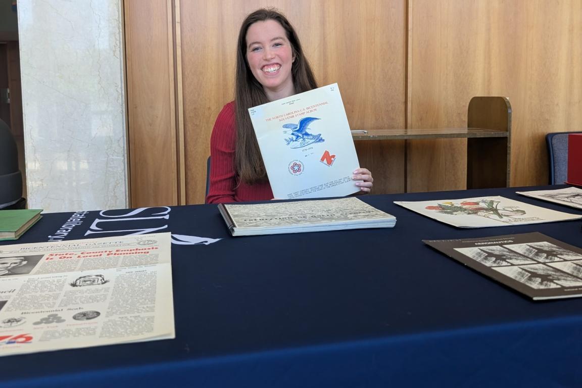 Librarian Taylor Thompson happily engaging the public during an outreach event