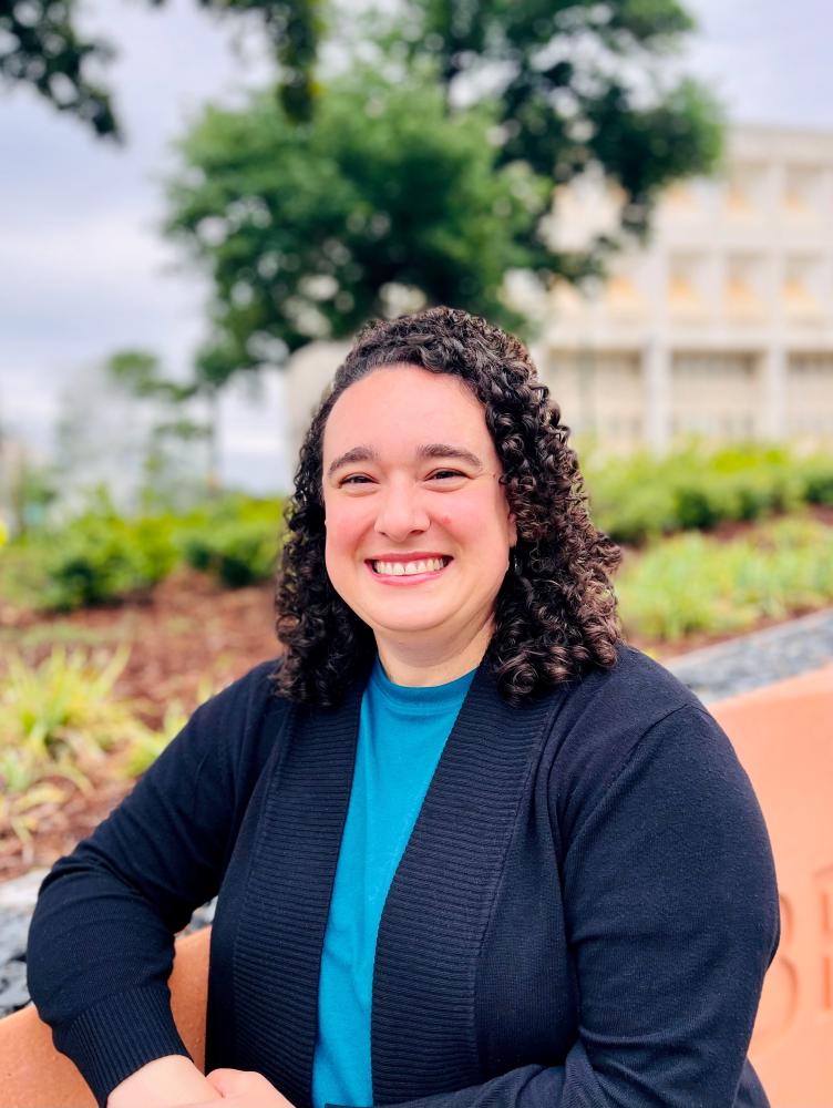 Clarisa Arguello in front of a landscape