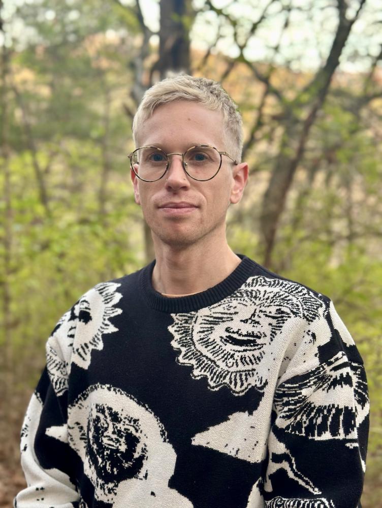 Image of Scott Frawley in front of a wooded background