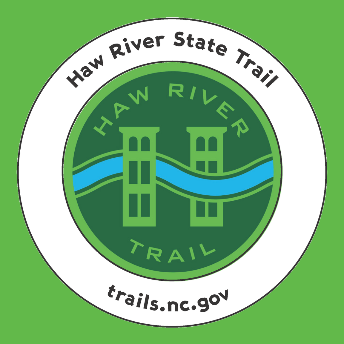 Haw River State Trail blaze with river and towers 