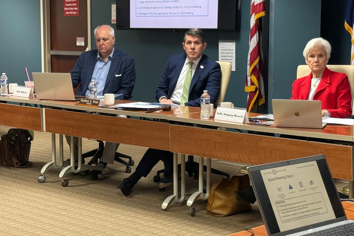 State Treasurer Brad Briner (center) and North Carolina Investment Authority Board of Directors members Mark Roberts and Sallie Shuping-Russell listen to presentations at the Dec. 17 board meeting.
