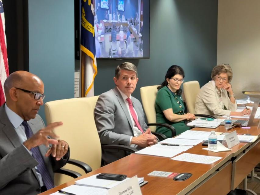 Members of the Local Government Commission discuss debt requests.