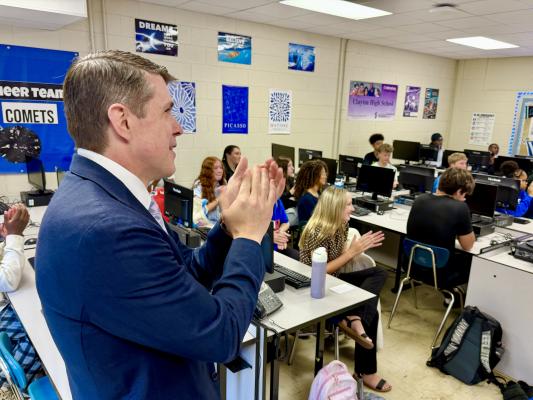 Treasurer Briner and students applaud Clayton High School teachers during Teacher Appreciation Week