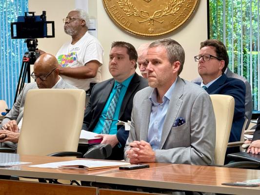 Charlotte Treasurer Matt Hastedt speaks at LGC about airport runway expansion.
